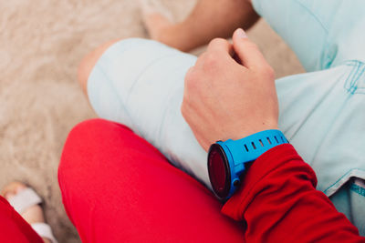 Low section of man sitting on floor