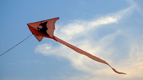 Low angle view of kite flying against sky