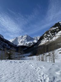 Snow covered mountains against sky