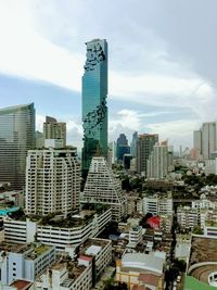 Modern buildings in city against sky