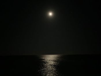 Scenic view of sea against sky at night