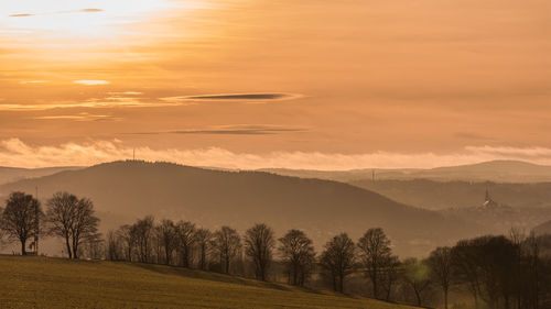 Scenic view of landscape against sky during sunset