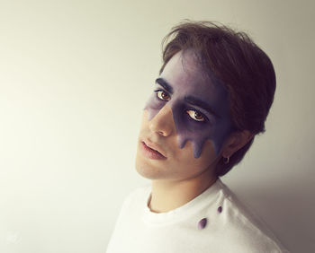 Portrait of boy against white background