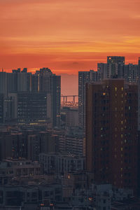 Modern buildings against romantic sky at sunset