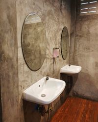 Sinks and mirrors on wall in restroom