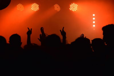 Silhouette people at music concert