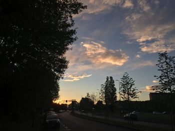 Road against cloudy sky at sunset