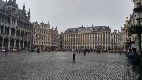 People at town square against sky