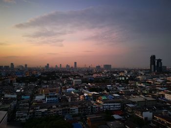 High angle view of buildings against sky during sunset