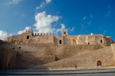 Low angle view of historic building against sky