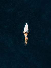 High angle view of man standing in water