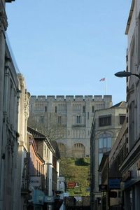 Buildings in city against clear sky