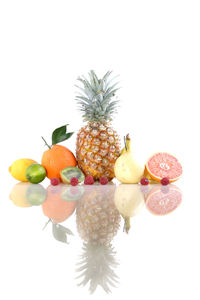 Close-up of fruit over white background