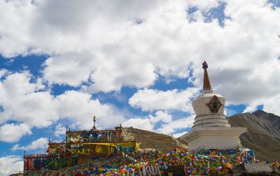 Low angle view of temple against cloudy sky