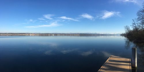 Scenic view of lake against blue sky