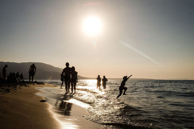 Creative light and shadow boy jumping greece beach mykonos creta