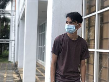 Portrait of a young man standing outdoors