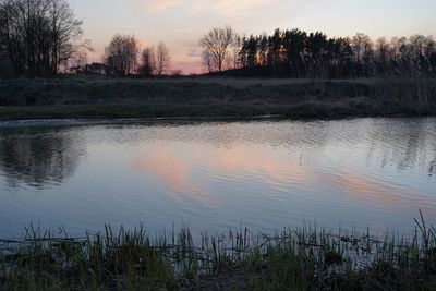 Scenic view of lake against sky during sunset