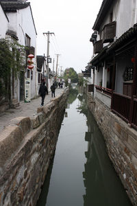 View of canal along buildings