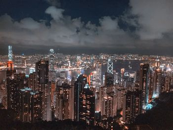 Aerial view of illuminated buildings in city at night