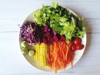 High angle view of chopped vegetables in bowl on table