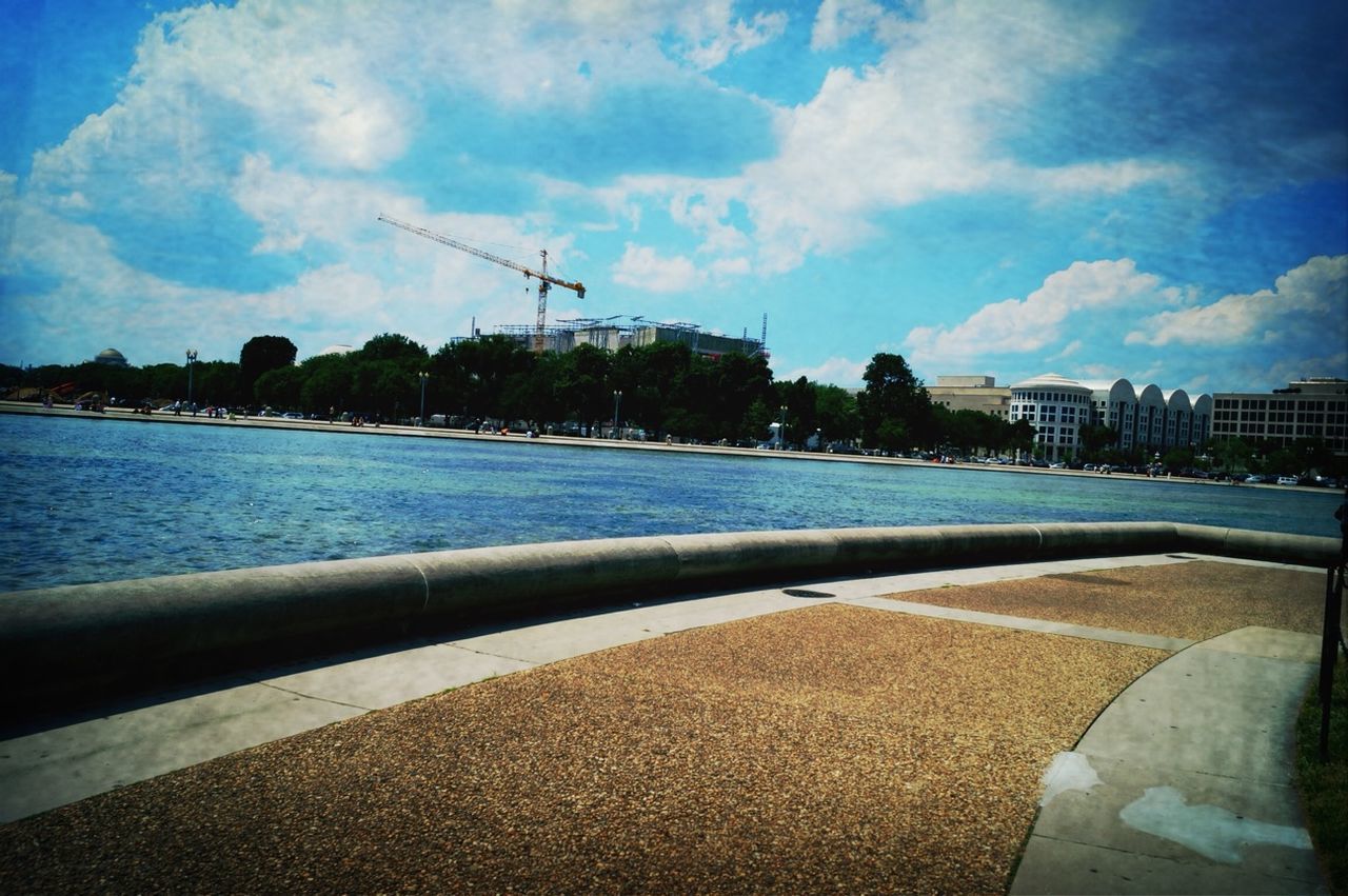 water, sky, sea, building exterior, built structure, architecture, blue, cloud - sky, cloud, nature, day, river, harbor, outdoors, tranquil scene, beauty in nature, tranquility, rippled, house, sunlight