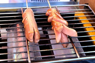 High angle view of meat on barbecue grill