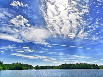 Scenic view of lake against blue sky