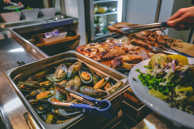 High angle view of food on table in restaurant. buffet mussels seafood dinner