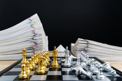 Close-up of chess board against black background