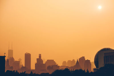 View of cityscape against sky during sunset