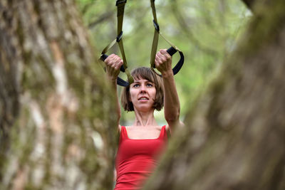 Mid adult woman exercising at park