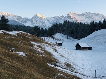 Scenic view of snow covered mountains against sky