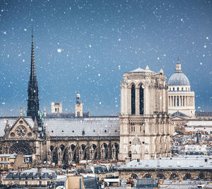 Buildings in city against sky