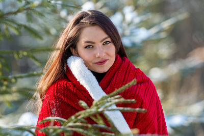 Portrait of smiling young woman during winter