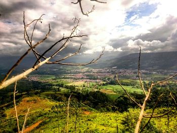 Scenic view of landscape against cloudy sky