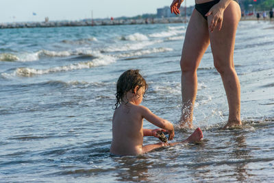 Mother and daughter in sea