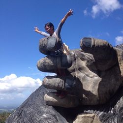 Low angle view of rocks against clear sky