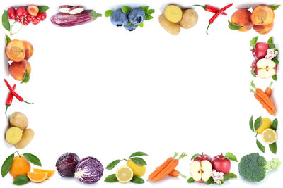 Close-up of fruits against white background