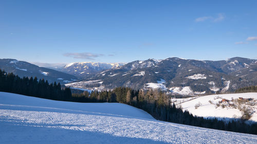 Scenic view of snowcapped mountains against sky