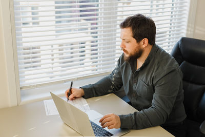 High angle view of businessman working at office