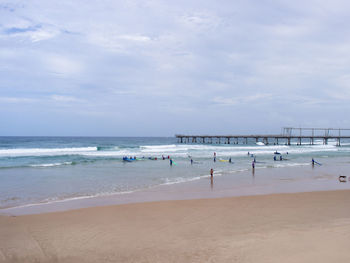 Surfers on a gold coast beach