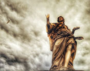 Low angle view of statue against sky