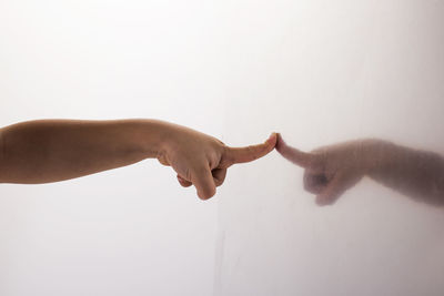 People on wall against white background