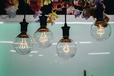 Close-up of light bulb hanging