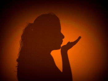 Silhouette of woman at sunset