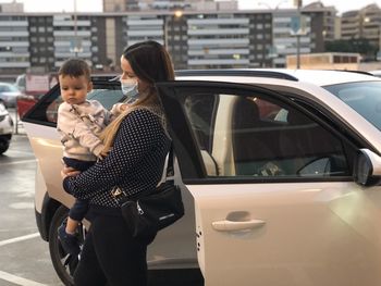 Women sitting in car