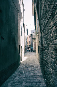 Narrow alley along buildings