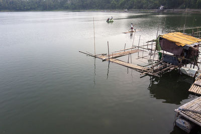 High angle view of people fishing in lake