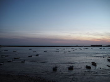 Scenic view of sea against sky at sunset